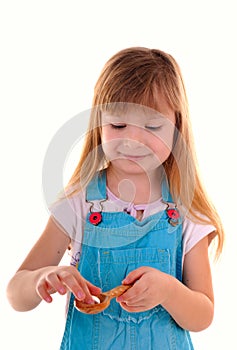 Small beauty girl with white tablet and spoon