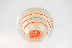 Small beige plate with red stripes. handwork. made on a potter s wheel, covered with transparent glaze, burned in a kiln
