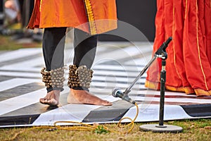 Small bells Ghungroo on male feet of indian dancer for ancient ethnic Kathak dance