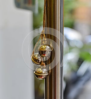 Small bells hanging on glass door