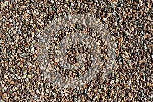 Small and big sand, gravel and pebbles background pattern