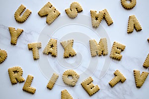 Small Biscuits Spelling `Tax Me`