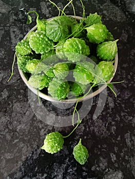 Small bitter gourd vegetable in a bowl indian variety