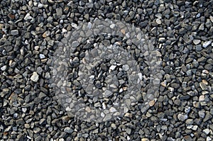 Small black gravel on road closeup