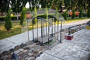 a small black metal bridge with horseshoes