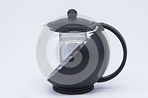 Small black plastic teapot.