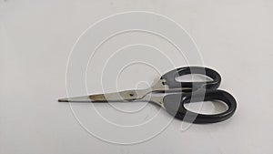 small black scissors on a white background
