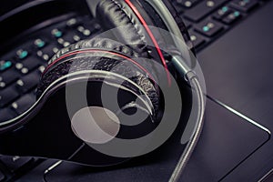 Small Black Wired Gaming Headset Lying On The Keyboard Of A Notebook