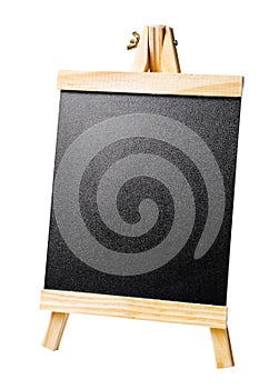 The Small blackboard with a wooden frame on a stand isolated on white background. Saved clipping path