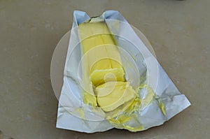 Natural Yellow Dairy Butter In wrapper photo