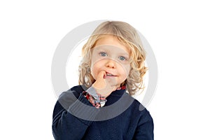 Small blond child bitting his nails