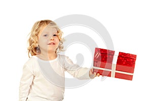 Small blond child with a red present