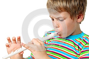 Small blonde boy with zeal blows horn photo