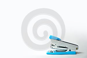Small Blue office stapler isolated on white background