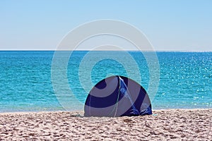 A Small Blue Shade Tent On A White Silica Sand Beach In Whitsundays Australia