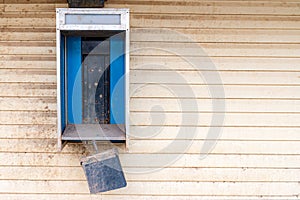 Empty Phone Booth On A Building Exterior