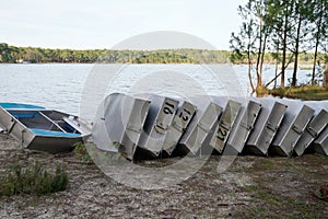 Small boat in aluminum learning school boats overturned Rowboats On Dock sand lake beach