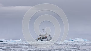 Small boat in antartic waters