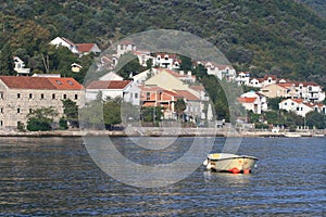 Small boat on the background of fishing village Stoliv