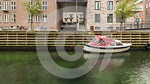 A small boat in a canal in Copenhagen, Denmark