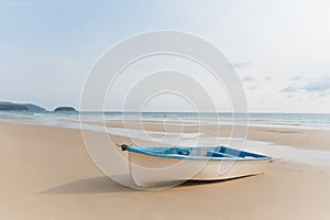 Small  boat on a clean beach