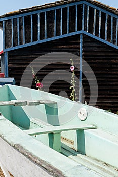 Small boat front wood hut in oyster village in Marennes Oleron in France