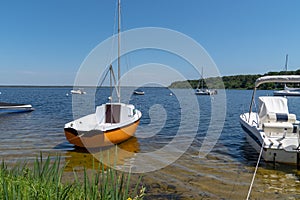 Small boat in Lacanau lake village in France