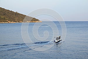 Small boat leaving the bay