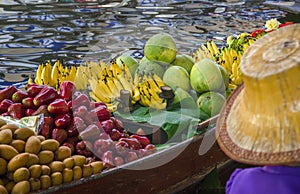 Small boat loaded with colourful fruits, Thailand