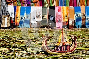 Small boat made from grass totora reeds, Titicaca lake, Peru photo