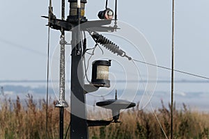 Small boat mast head radio, lights, radar and aerials. photo