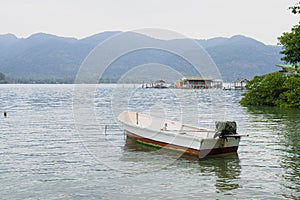 A small boat moored at the beach