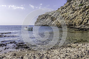 Small boat moored in a tranquil bay