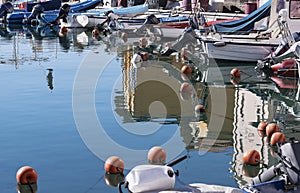 Small boat motors in a row