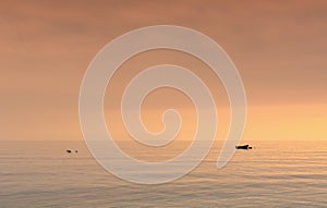 small boat at nachor in a calm ocean at sunset