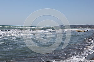 Small boat near the sea shore at daytime