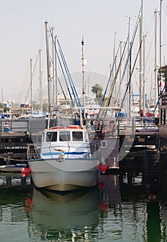 The small boat on a quay background