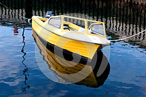 Small boat reflecting on sea