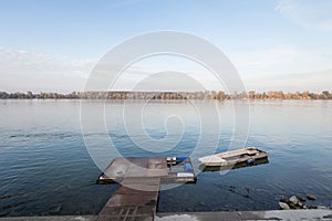 Small boat, a rowing boat, tied to a pontoon on Zemunski Kej, the main quay of Zemun, on the Danube banks in Belgrade, Serbia.