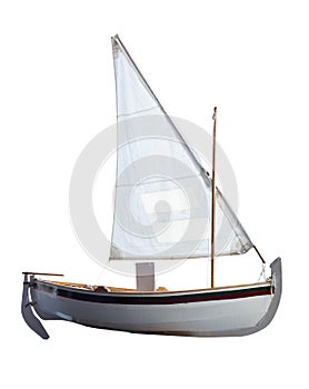 Small boat with sails unfurled