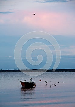 Small boat in the sea at evening near Middelfart, Denmark