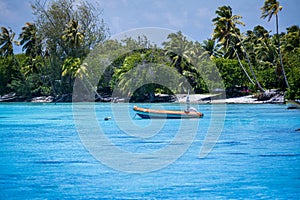 Small Boat Tied -up in Beautiful Blue Water