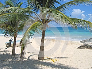 A small boat, a tropical beach