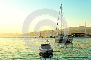 Small boat, yacht, fishing trawler and sailboat moored in the harbor of a small town Postira - Croatia, island Brac