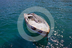 Small boat at Zeus Bay in the Aegean Sea