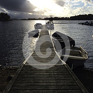 Small boats fixed on a boat dock