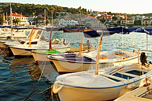 Small boats moored in the harbor of a town Postira - Croatia, island Brac