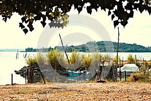 Small boats moored on Lake Trasimeno Umbria, Italy