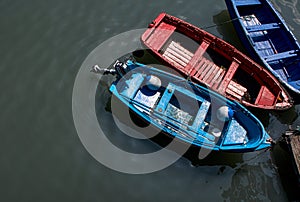 Small boats moored in the port photo