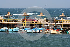 Small boats moored to a jetty